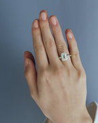Model wears Elizabeth 5ct emerald cut tapered baguette engagement ring in 18ct white gold