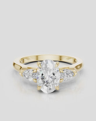 Bonaparte oval pear side stone engagement ring in 18ct yellow gold