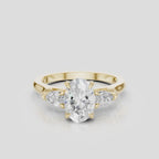 Bonaparte oval pear side stone engagement ring in 18ct yellow gold