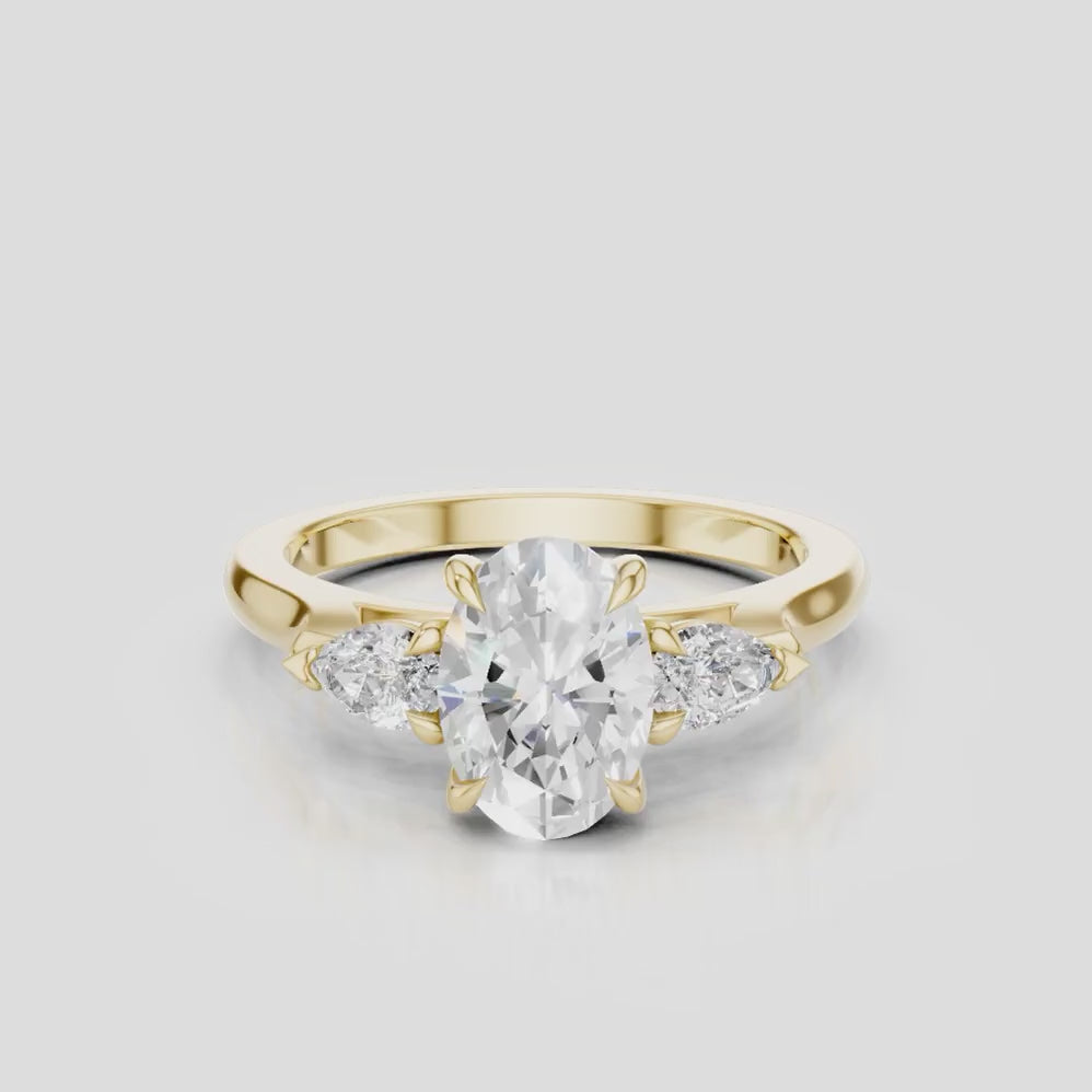 Bonaparte oval pear side stone engagement ring in 18ct yellow gold