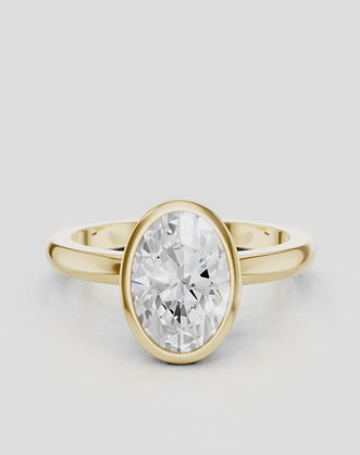 Fairfax oval solitaire bezel north-south engagement ring in 18ct yellow gold