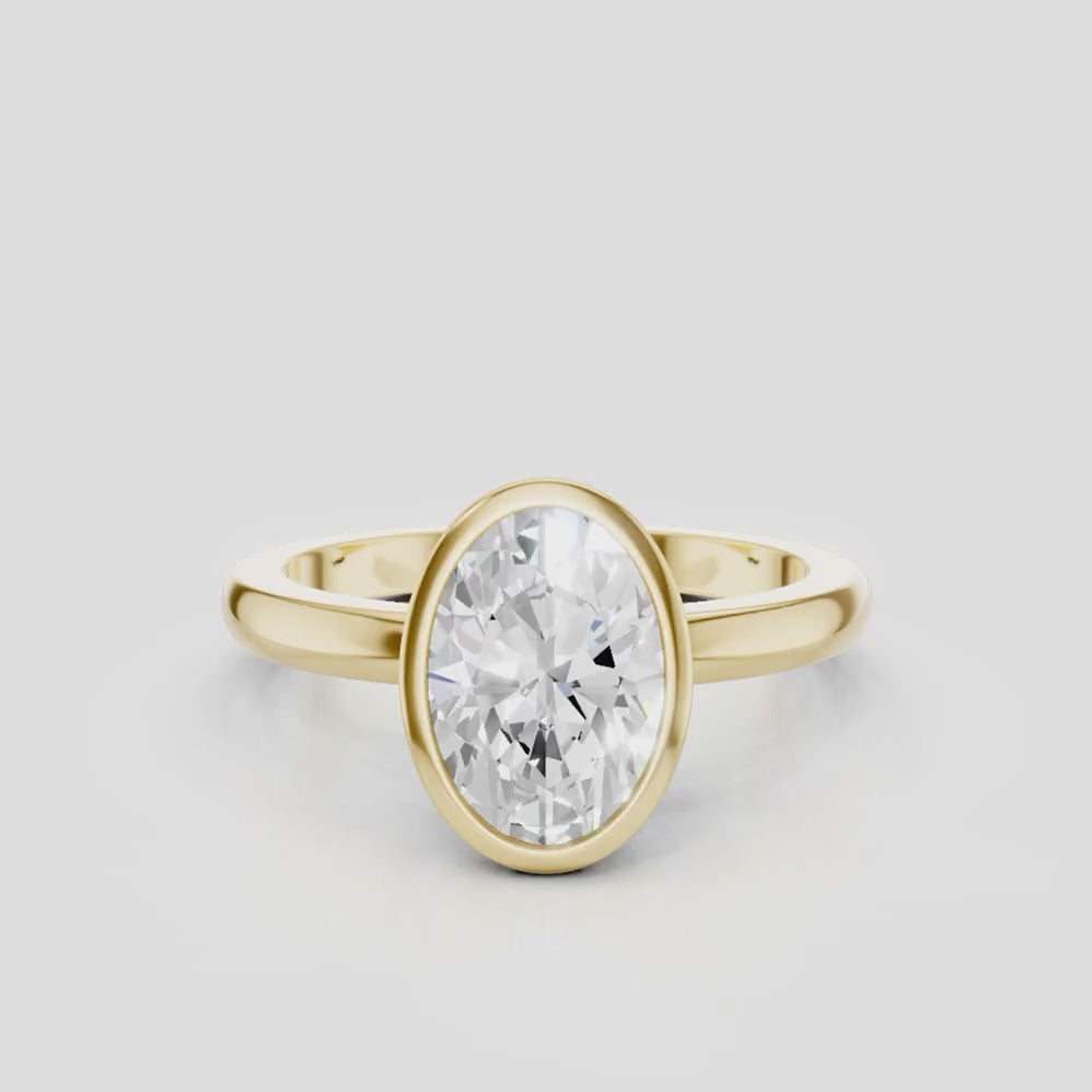 Fairfax oval solitaire bezel north-south engagement ring in 18ct yellow gold