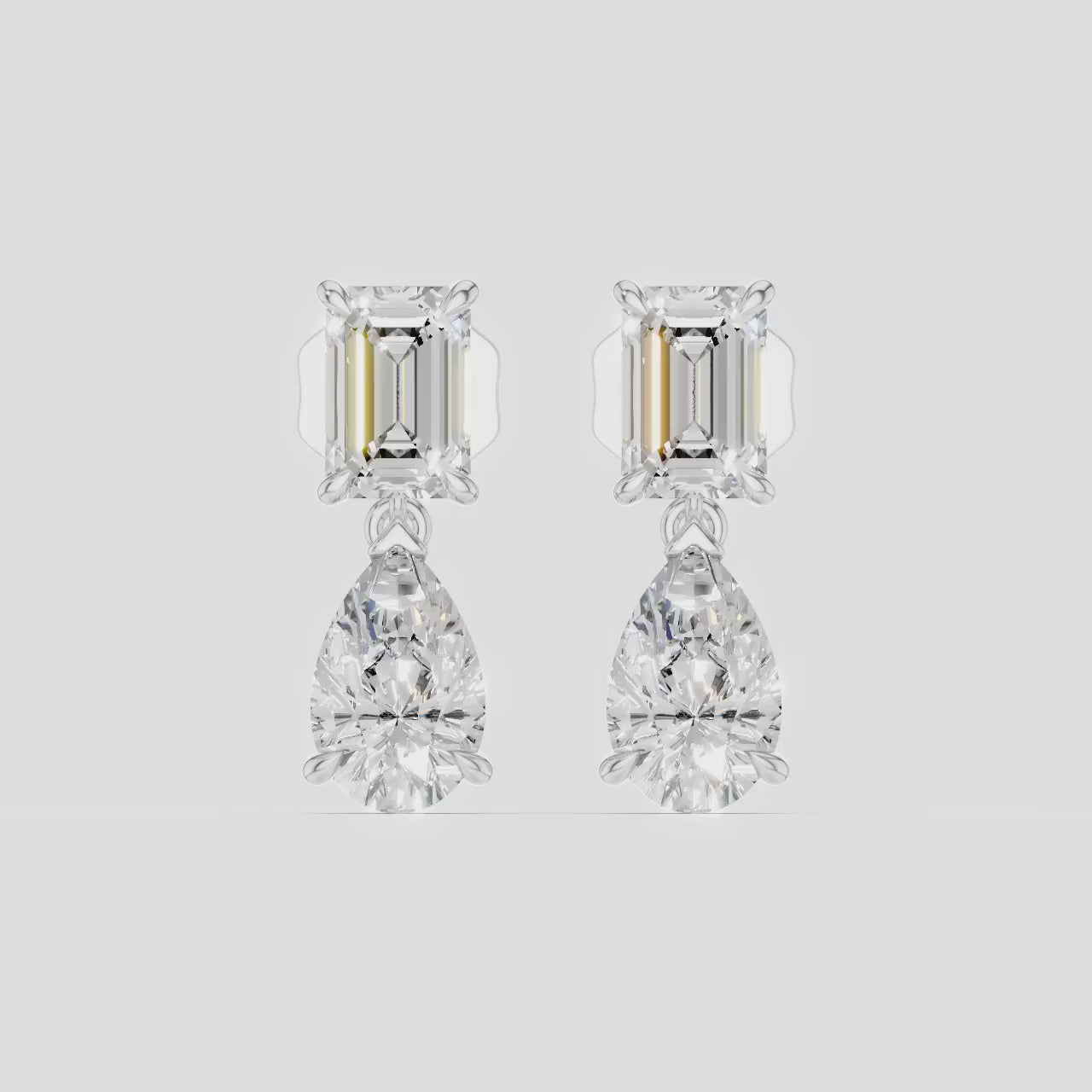 Madame 0.50ct emerald pear cut drop earrings in 18ct white gold
