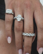 Close-up model wears Cheyne 0.50ct round brilliant half eternity band in 18ct white gold