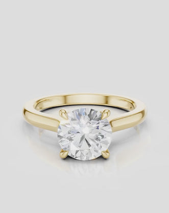 Sloane round brilliant four claw solitaire swept shoulder engagement ring in 18ct yellow gold