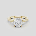 Sloane round brilliant four claw solitaire swept shoulder engagement ring in 18ct yellow gold