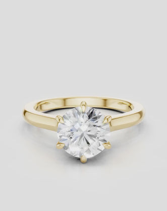Cambon round brilliant six claw solitaire swept shoulder engagement ring in 18ct yellow gold