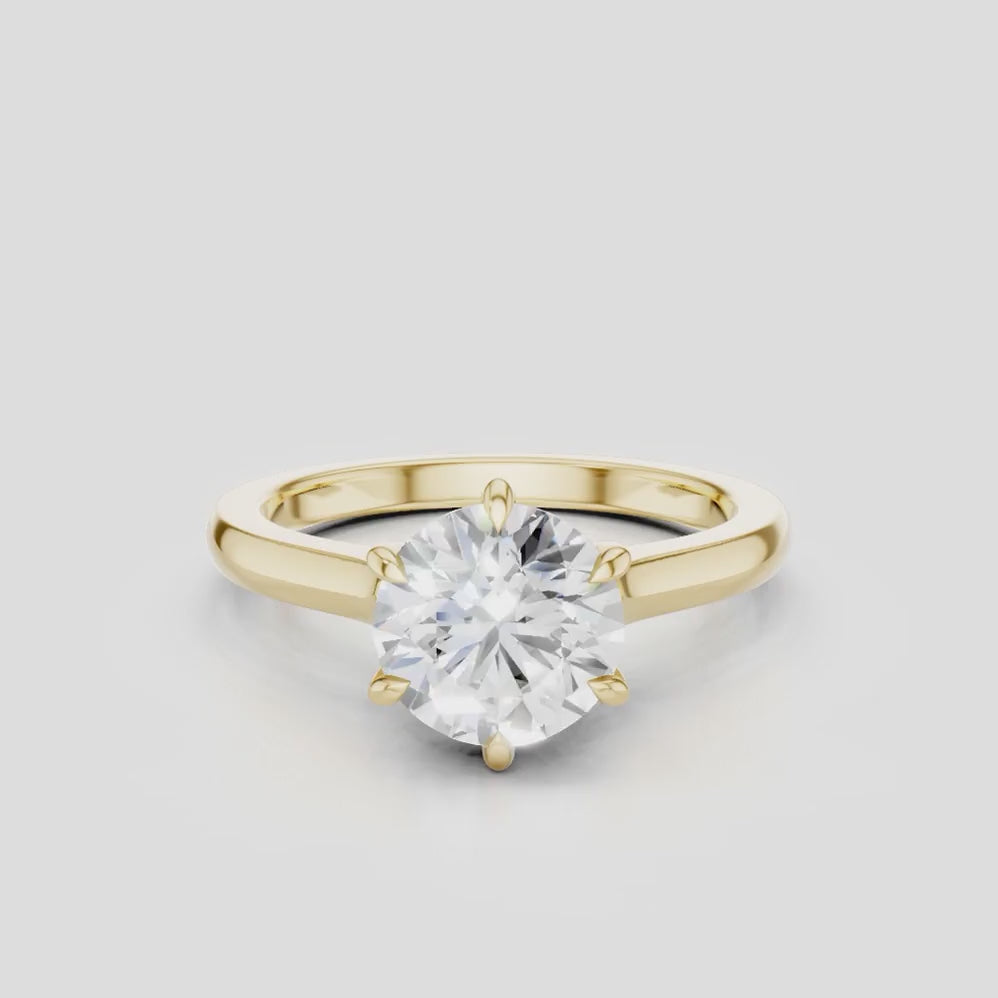 Cambon round brilliant six claw solitaire swept shoulder engagement ring in 18ct yellow gold