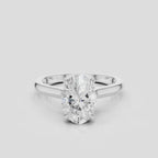 Montaigne oval solitaire swept shoulder engagement ring in platinum