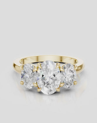 Clarkson oval trilogy engagement ring in 18ct yellow gold