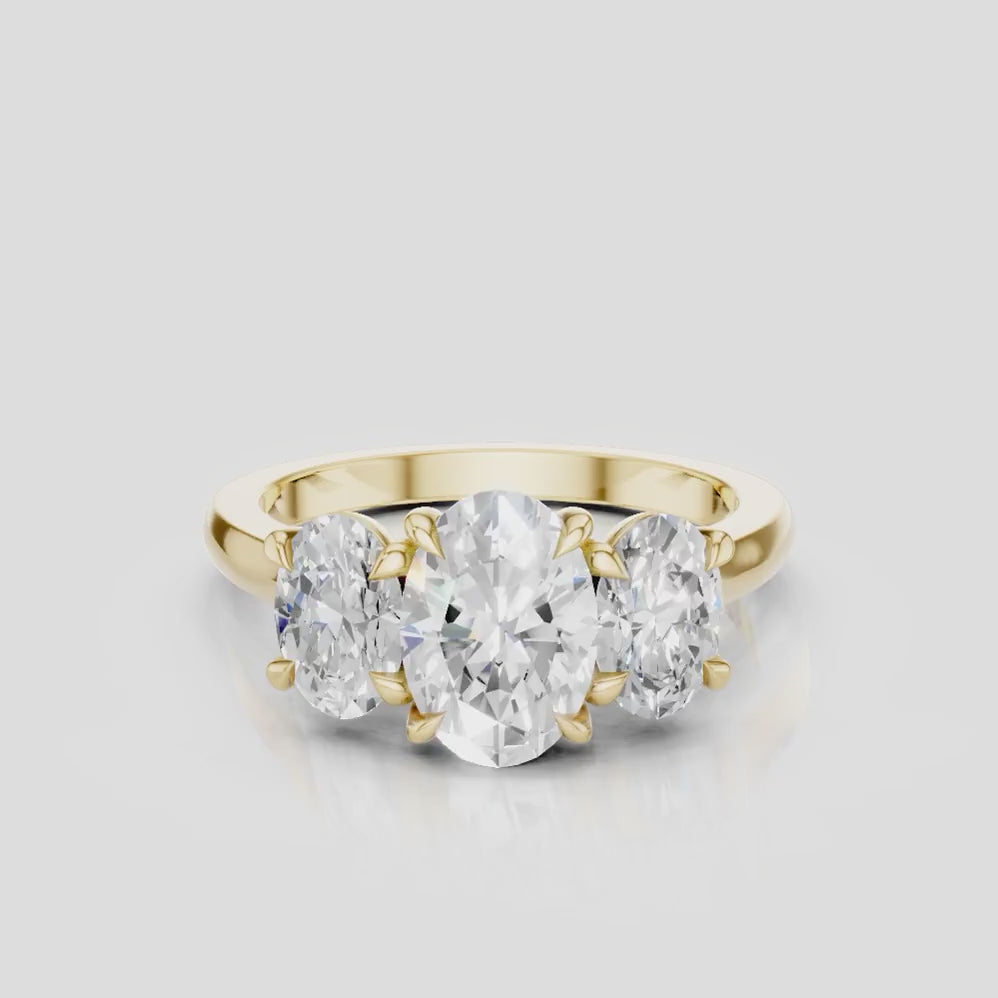 Clarkson oval trilogy engagement ring in 18ct yellow gold
