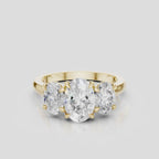 Clarkson oval trilogy engagement ring in 18ct yellow gold
