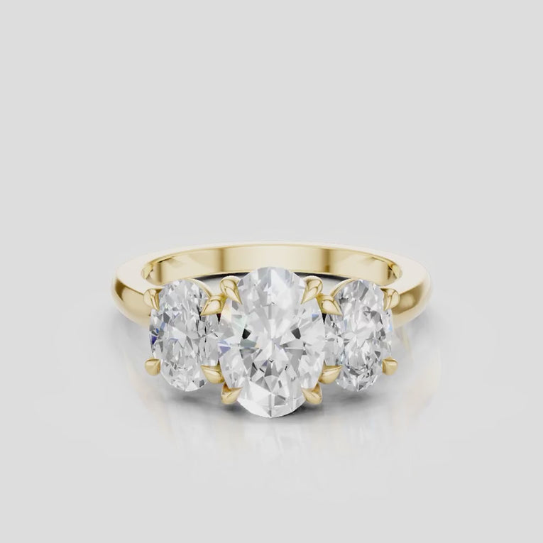 Clarkson oval trilogy engagement ring in 18ct yellow gold