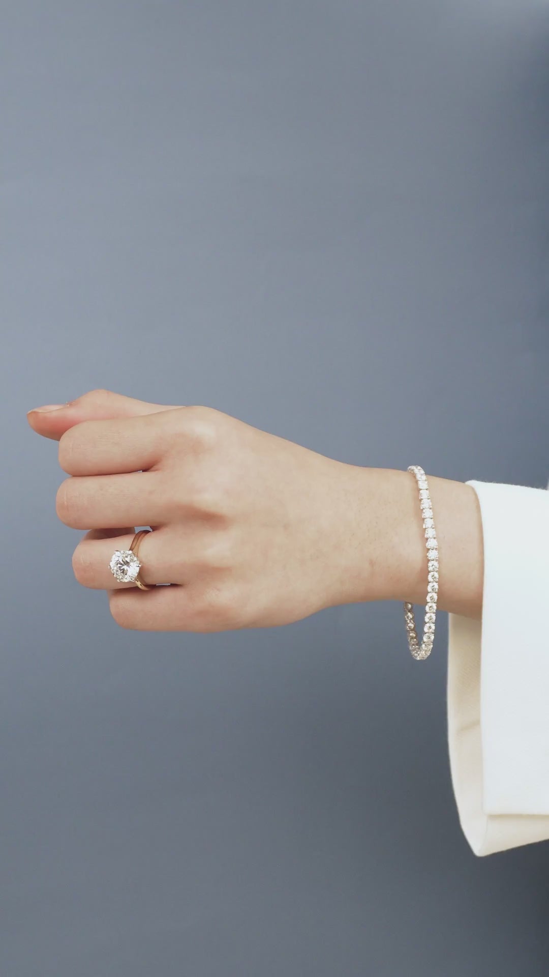 Model wears Cheyne 0.30ct round brilliant half eternity band in 18ct yellow gold