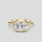 Maddox oval solitaire bezel east-west engagement ring in 18ct yellow gold