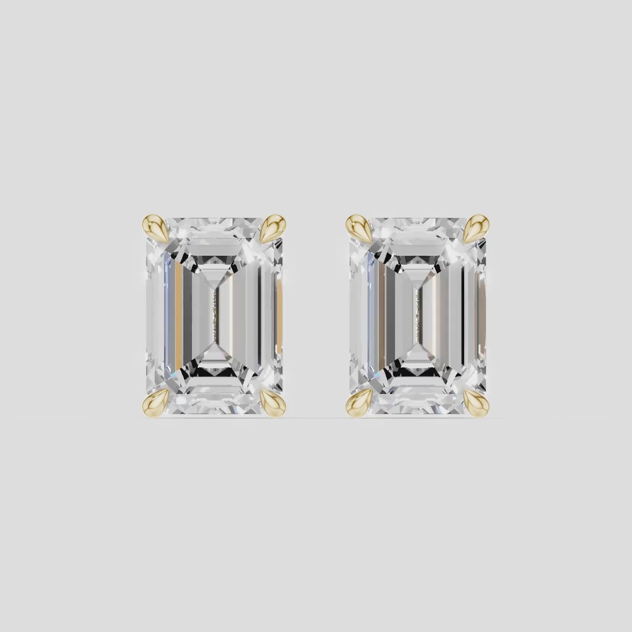 Clark 2ct emerald cut diamond studs in 18ct yellow gold