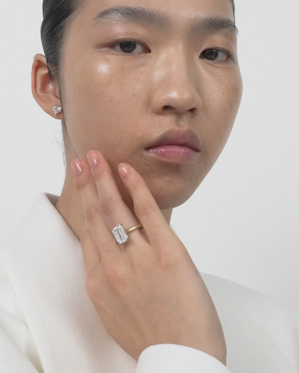 Model wears Melrose 0.50ct heart shape half eternity band in 18ct yellow gold
