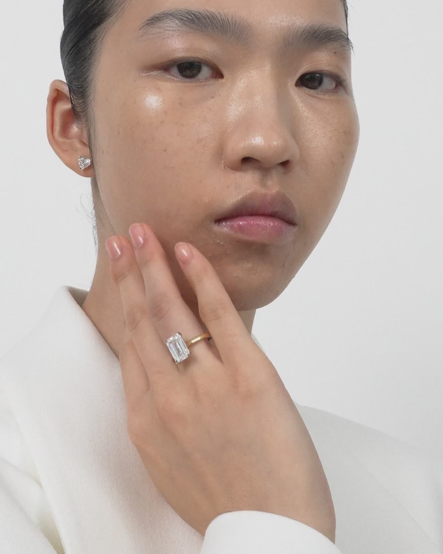 Model wears Melrose 0.50ct heart shape half eternity band in 18ct yellow gold