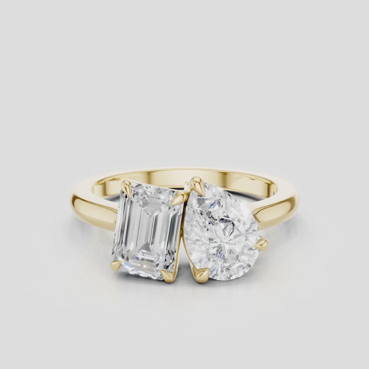 Kinney Toi Et Moi pear emerald engagement ring in 18ct yellow gold