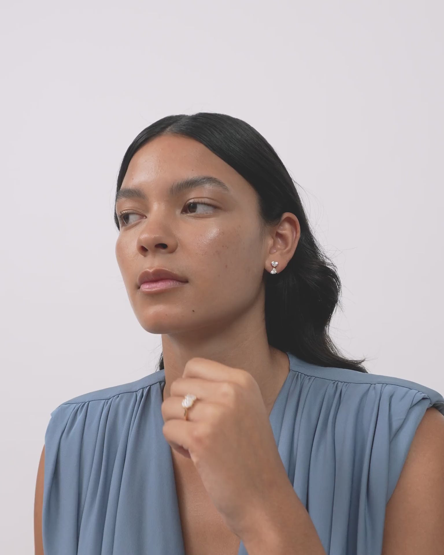 Model wears Notting romantic pair double 0.50ct heart shape drop earrings in 18ct gold