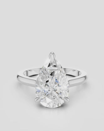 Dauphine pear cut solitaire classic engagement ring in 18ct white gold