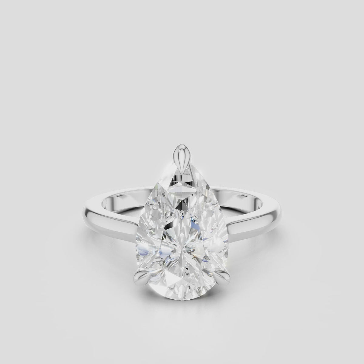 Dauphine pear cut solitaire classic engagement ring in 18ct white gold