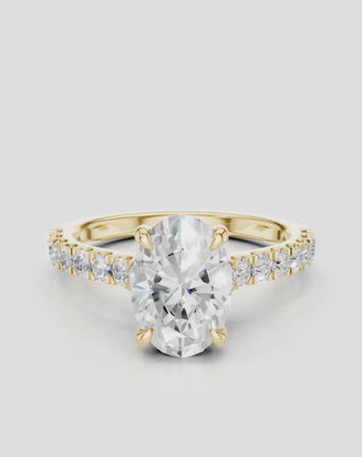 Nassau oval cut diamond band engagement ring in 18ct yellow gold
