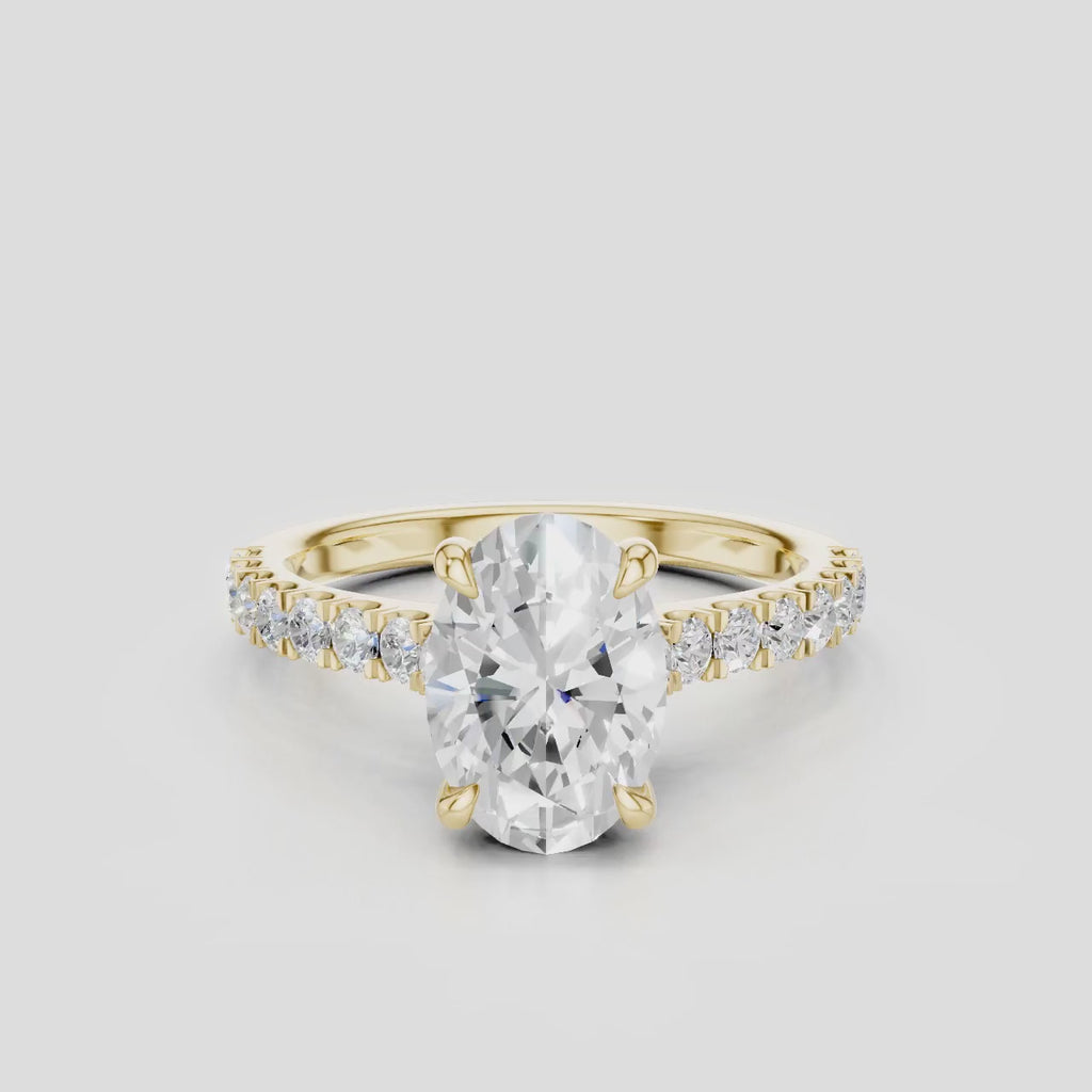 Nassau oval cut diamond band engagement ring in 18ct yellow gold